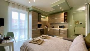 a bedroom with a bed with two towels on it at Collegno Centro - Il Bumbunin... in Collegno