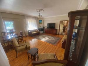 an overhead view of a living room with a couch and chair at Nature Gate Airport Hotel in Arnavutköy