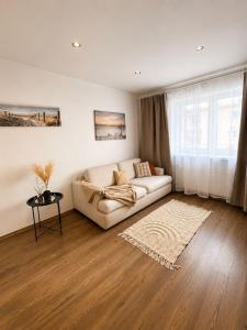 a living room with a couch and a table at Kaare in Uuemõisa