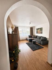 a living room with a couch and a table at Kaare in Uuemõisa