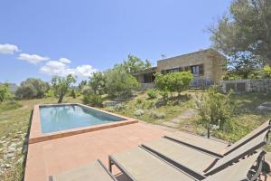 an image of a house with a swimming pool at Villa Font in Artá