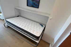 a mattress on a bed frame in a room at Studio with balcony and pool in La Baule in La Baule