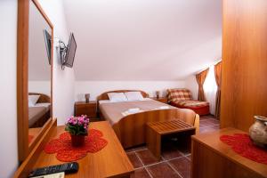 a small bedroom with a bed and a table at Villa Ipera in Budva +44 photos