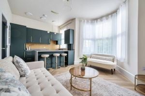 a living room with a couch and a table at Number 6 in Margate