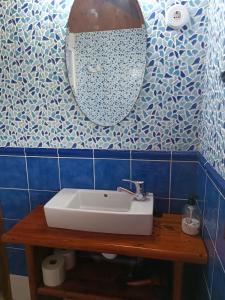 a bathroom with a white sink and a mirror at La Xana Ribadesella in Ribadesella +102 photos