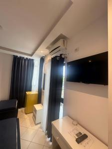 a small living room with a couch and a table at Hotel Riviera in Durrës