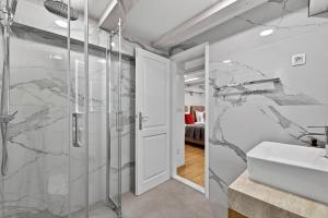 a bathroom with a shower and a sink at Solis Rooms Old Town in Dubrovnik