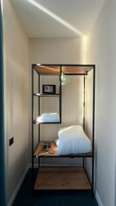 a shelf with a bed and a clock on it at Pano Hotel in Gonio +36 photos