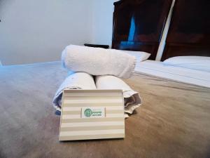 a box sitting on the floor in a bedroom at Suite Excelsior - Bordighera in Bordighera