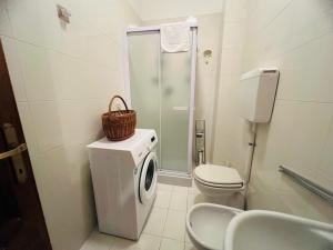 a bathroom with a toilet and a shower and a sink at Suite Excelsior - Bordighera in Bordighera +19 photos