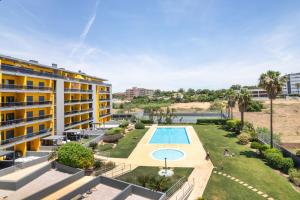 an aerial view of a resort with a swimming pool at Parque Atlântico Apartment in Quarteira