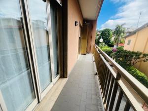 a walkway leading to a balcony of a building at Suite Excelsior - Bordighera in Bordighera