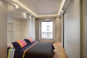 Tempat tidur dalam kamar di Faubourg Chic