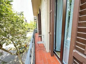 an empty balcony with a window on a house at Rooms Diputacion in Barcelona