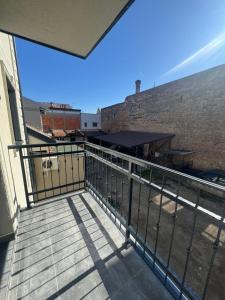 a balcony with a metal railing on a building at Apartmani Ljupko in Pančevo