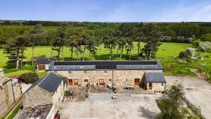 an aerial view of a building with solar panels on it at Miller's Wheel in Harrogate
