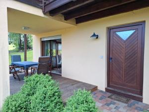 a front door of a house with a table and chairs at FW Körner in Zwiesel