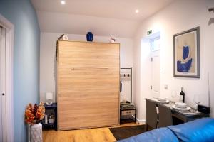 a large wooden door in a living room at Stylish Apartment Coppcliffe Grantham in Grantham