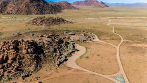 an aerial view of a village on a mountain at Namib Naukluft Lodge in Solitaire