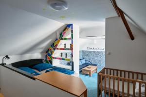 a room with a loft with a bed and a table at CHALUPA in Hosty +19 photos
