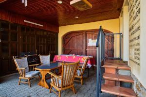 a dining room with a table and chairs at CHALUPA in Hosty