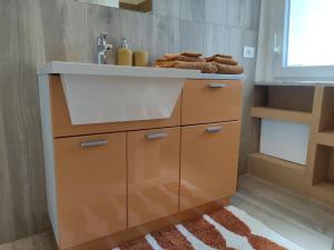 a bathroom with a sink and a counter at Casa di Lucio in Lodi +15 photos