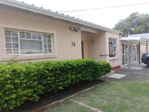 a house with the number on the side of it at 75 on Albert Guesthouse in Gqeberha