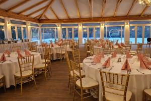 a banquet hall with tables and chairs in a room at Bodrogi Kúria Wellness Hotel in Inárcs +57 photos