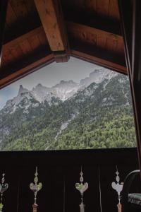 a view of a mountain range from a window at Ferienwohnung Alpenwelt in Mittenwald