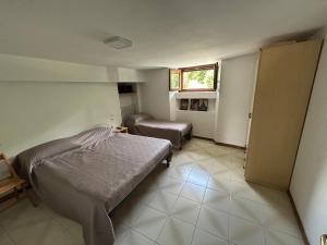 a small bedroom with a bed and a window at LB Guest House in Tagliacozzo