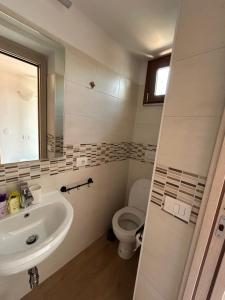 a bathroom with a sink and a toilet at LB Guest House in Tagliacozzo