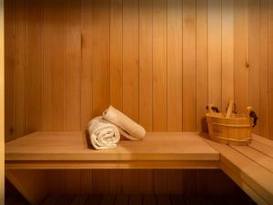 a towel sitting on a shelf in a sauna at Chalet Aravista - OVO Network in Le Grand-Bornand