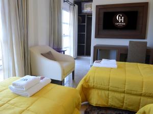 Postel nebo postele na pokoji v ubytování Ceferino Hotel
