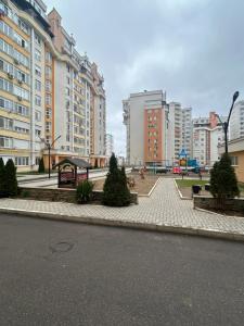 a street in a city with tall buildings at Classic Contemporary Apartament in Chişinău