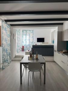a kitchen and dining room with a table and chairs at Casa Pont1 Historic Pontone near Amalfi & Ravello in Scala