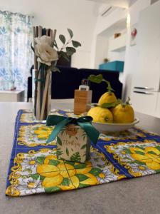 a table with a plate of pears on a table at Casa Pont1 Historic Pontone near Amalfi & Ravello in Scala