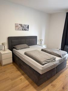a bedroom with a large bed in a room at Hansehaus Lübeck - Stadtnest in Lübeck