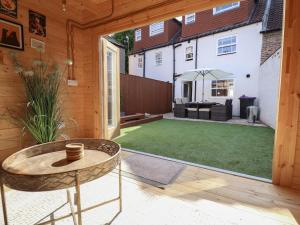 a garden with a patio and a lawn at 4 Eve Street in Louth