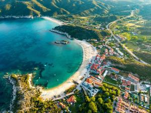 an aerial view of a beach and the ocean at Noima Kalamitsi Boutique Studios in Kalamitsi