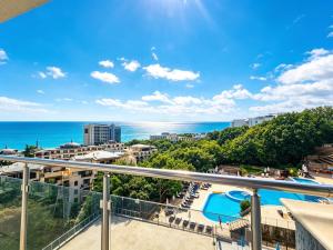 a view of the ocean from the balcony of a condo at Europroperties Yalta Apartments in Golden Sands