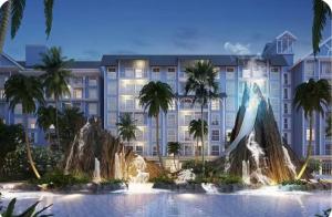 a rendering of the exterior of a hotel with a fountain at Pattaya Private Beach - Grand Florida Beachfront Condo Resort in Na Jomtien