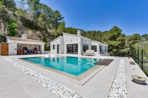 a swimming pool in the backyard of a house at Caray - Managed by Almarina Villas in Benissa