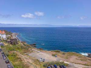 an aerial view of a beach and the ocean at Horizon living Madeira in Caniço
