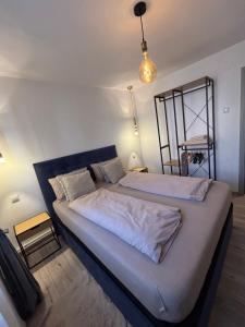a bedroom with a large bed in a room at Ralfi in Alba Iulia