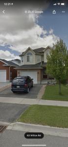 a car parked in front of a house at Sweet Dreams in Guelph