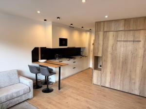 a living room with a table and a couch at Excelsior Top 17 Alpenherz in Seefeld in Tirol +11 photos