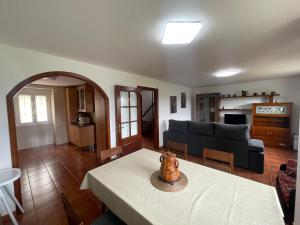 a living room with a couch and a table at Casa Balsas in A Coruña
