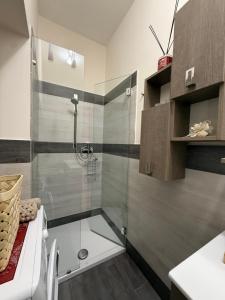 a bathroom with a shower with a glass door at Casa Pont1 Historic Pontone near Amalfi & Ravello in Scala +22 photos