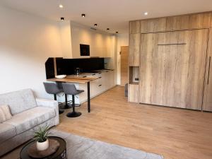 a living room with a couch and a table at Excelsior Top 17 Alpenherz in Seefeld in Tirol