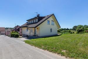 a white house on the side of a road at Landzeit in Efringen-Kirchen